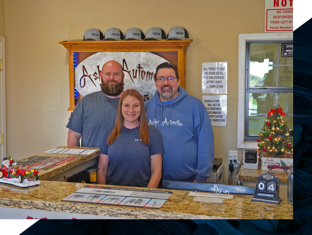 Asher Automotive employees at the front desk